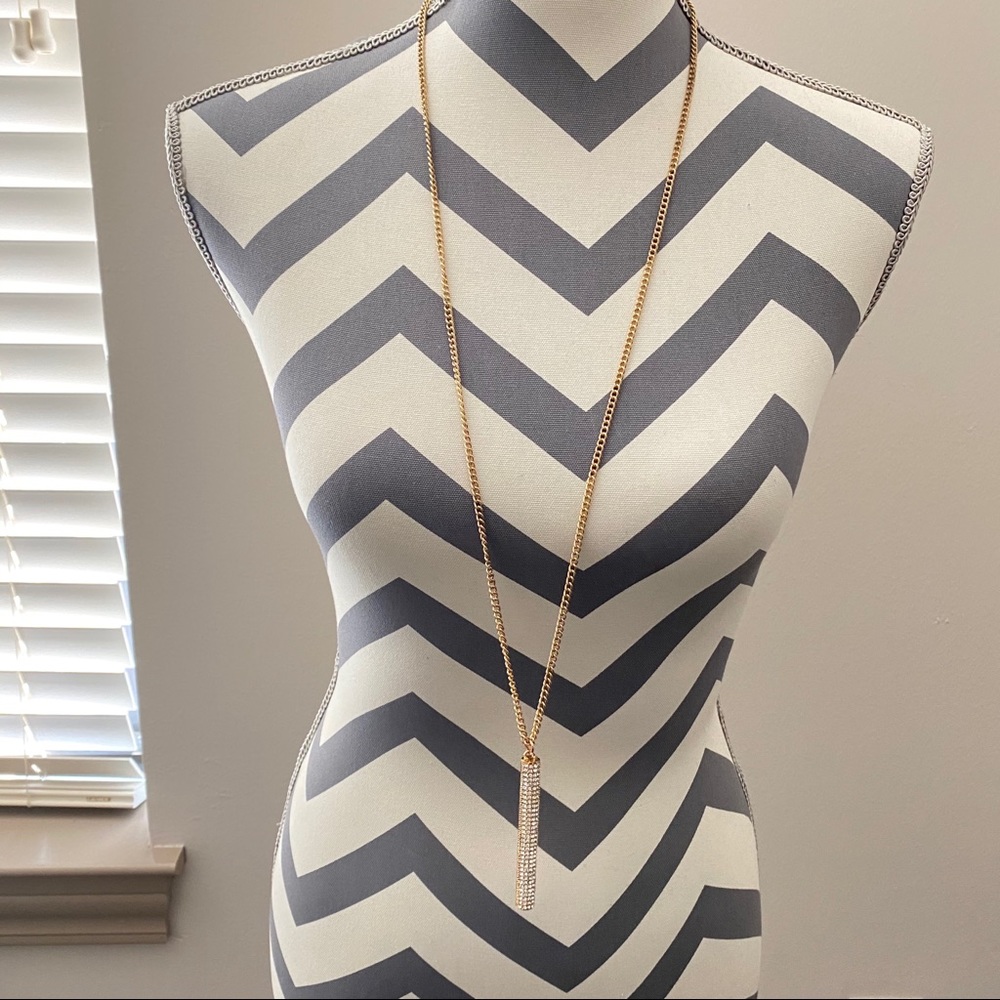 Long strand necklace with rhinestones